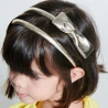 Metallic headband with a bow