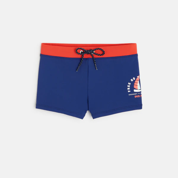 Beach shorts with a sailboat motif