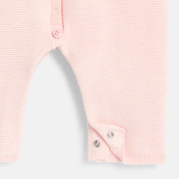 Newborns' knitted jumpsuit with pink ruffled collar