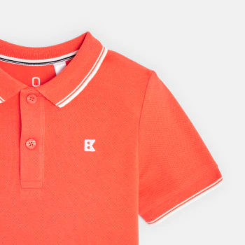 Boy's orange short-sleeve polo shirt.