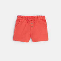 Baby girl's orange shorts...