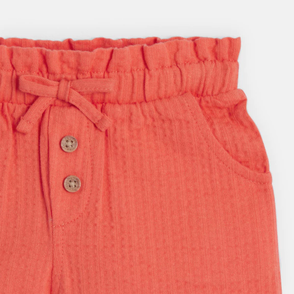 Baby girl's orange shorts in lightweight textured cotton