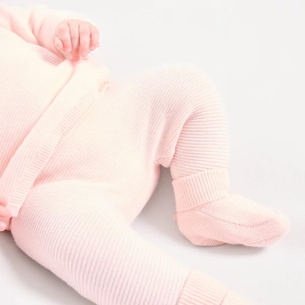 Newborn pink knitted fabric trousers with feet