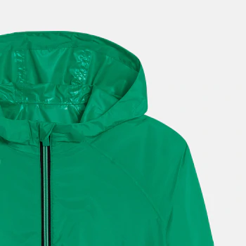 Boy's green waterproof windcheater jacket.