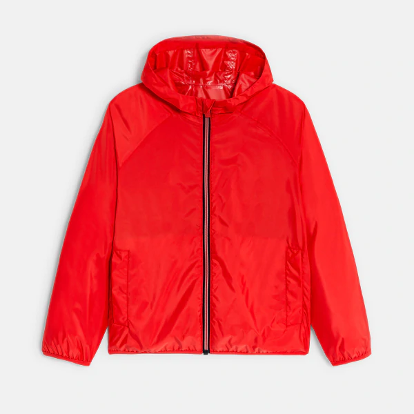 Boy's red waterproof windcheater jacket.