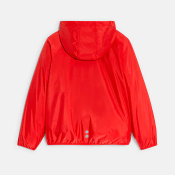 Boy's red waterproof windcheater jacket.