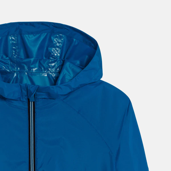 Boy's blue waterproof windcheater jacket.