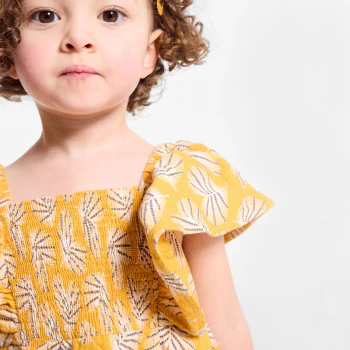 Baby girl's yellow smoked dress in textured cotton