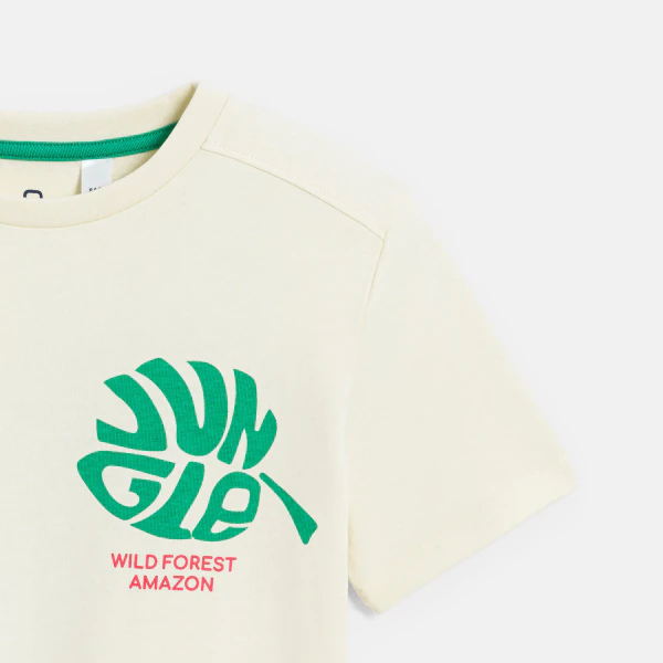 Boy's off-white T-shirt with a slogan and leaf motif on the front and back