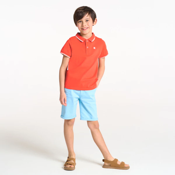 Boy's orange short-sleeve polo shirt.