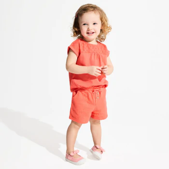 Baby girl's orange shorts in lightweight textured cotton