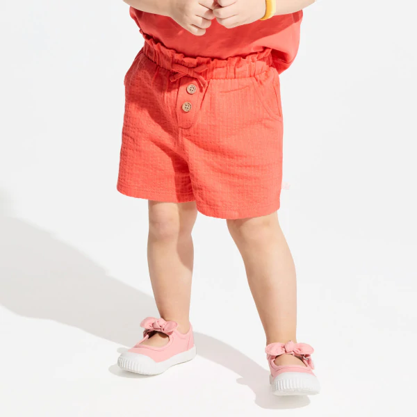 Baby girl's orange shorts in lightweight textured cotton