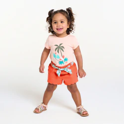 Baby girl's orange printed scalloped shorts with a belt