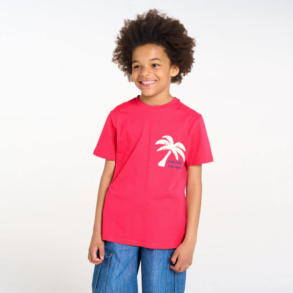 Boy's pink T-shirt with a slogan and palm tree motif on the front and back