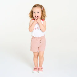 Baby girl's pink shorts in lightweight textured cotton