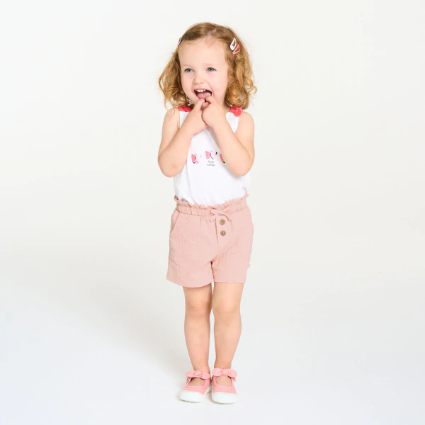 Baby girl's pink shorts in lightweight textured cotton