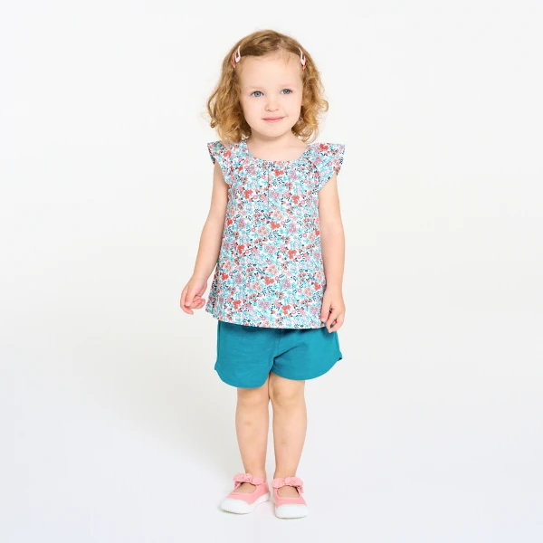 Baby girl's floral blouse and blue shorts