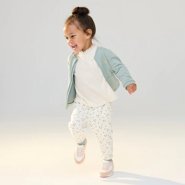 Baby girl's white floral fleece trousers